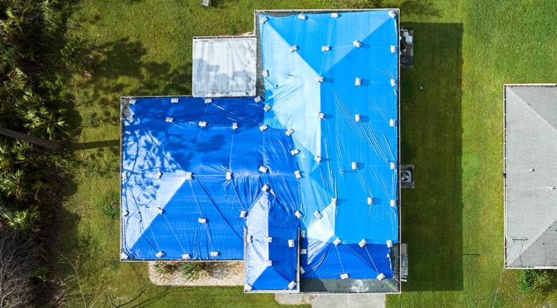 Roof Tarping: How-To, The Process, Longevity, and Safety - Roof Tarping For Gutter Backup